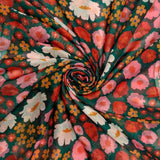 Green scarf with colourful daisies