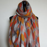 Grey scarf with orange, mustard & white leaves