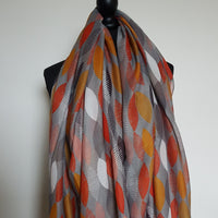 Grey scarf with orange, mustard & white leaves