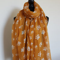 Mustard scarf with white paw prints