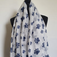 White scarf with blue paw prints